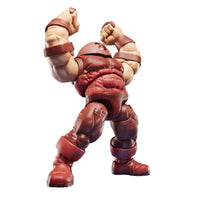Marvel Legends The Great Devastator action figure posed with fists raised, set against a black background with a green grid and blue floor lines. Marvel Legends logo is visible in the bottom right corner.