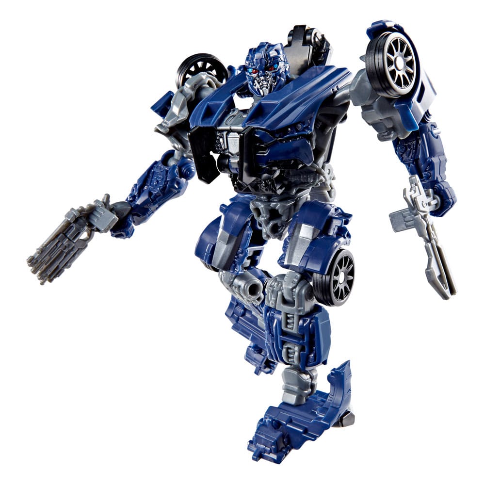 Hasbro Transformers Studio Series Barricade action figure in blue and grey robot mode holding two weapon accessories.