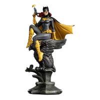 Iron Studios 1/10 Batgirl Deluxe Art Scale statue in a grey and yellow suit, perched on a stone gargoyle base.