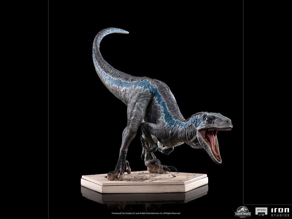 Side view of the 19 cm Iron Studios Jurassic World Blue 1/10 scale statue with detailed skin texture on a base.