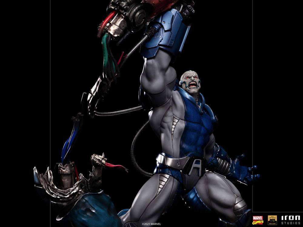 Iron Studios 1/10 Apocalypse Deluxe statue featuring the X-Men villain in blue and grey armor with a raised mechanical arm.