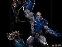 Iron Studios Apocalypse Deluxe 1/10 scale statue in blue and grey armor, featuring a dynamic pose on a black background.
