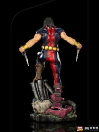 Back view of Iron Studios Warpath 1/10 scale statue featuring blue and red suit, gold belt, and dual knives.