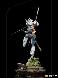 Side view of Iron Studios Spiral 1/10 scale statue featuring six arms, swords, and a detailed rocky base.