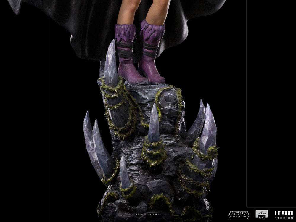 Close-up of the Iron Studios Evil-Lyn 1/10 scale statue, showing purple boots standing on a jagged, vine-covered base.