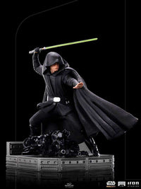 Iron Studios 1/10 Luke Skywalker Combat Version statue in black robes wielding a green lightsaber on a base.