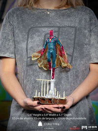 Iron Studios 1/10 scale Vision statue from WandaVision, featuring a floating pose with a fabric cape on a base.